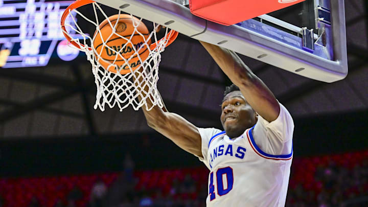 Feb 15, 2025; Salt Lake City, Utah, USA; Kansas Jayhawks forward Flory Bidunga (40) dunks the ball against the Utah Utes during the first half at the Jon M. Huntsman Center.\