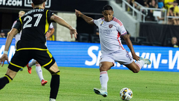 Sep 21, 2024; Columbus, Ohio, USA; Orlando City forward Luis Muriel (9) shoots the ball on goal while  Columbus Crew forward Max Arftsen (27) defends in the second half at Lower.com Field. Mandatory Credit: Trevor Ruszkowski-Imagn Images