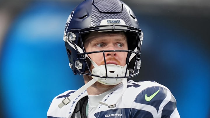 Dec 28, 2025; Charlotte, North Carolina, USA; Seattle Seahawks quarterback Sam Darnold (14) looks on before the game against the Carolina Panthers at Bank of America Stadium.