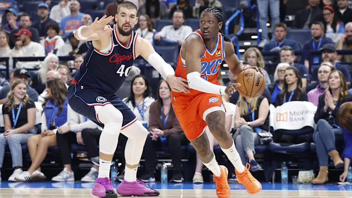 Nov 11, 2024; Oklahoma City, Oklahoma, USA; Oklahoma City Thunder forward Jalen Williams (8) drives around Los Angeles Clippers center Ivica Zubac (40) during the second quarter at Paycom Center. Mandatory Credit: Alonzo Adams-Imagn Images