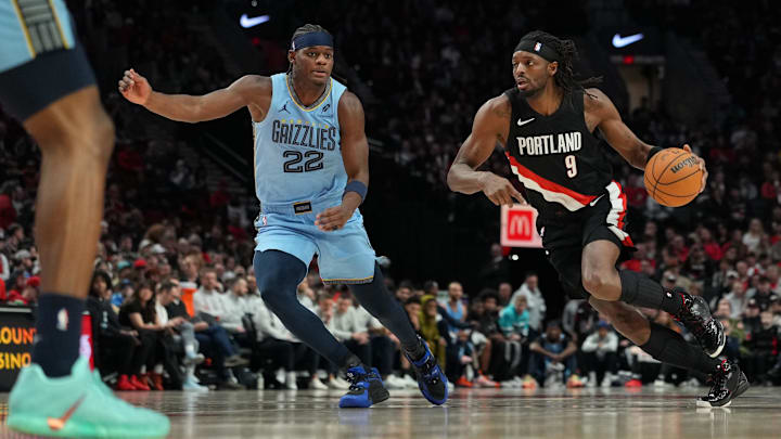 Feb 7, 2026; Portland, Oregon, USA; Portland Trail Blazers forward Jerami Grant (9) dribbles against Memphis Grizzlies forward Taylor Hendricks (22) during the first half at Moda Center. Mandatory Credit: Soobum Im-Imagn Images