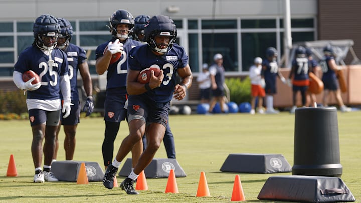 Roschon Johnson carries during training camp last year. If the Bears look draft a back, Johnson could be battling for his job.