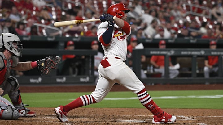 Sep 15, 2025; St. Louis, Missouri, USA; St. Louis Cardinals second baseman Brendan Donovan (21) hits a single against the Cincinnati Reds in the sixth inning at Busch Stadium. Mandatory Credit: Joe Puetz-Imagn Images