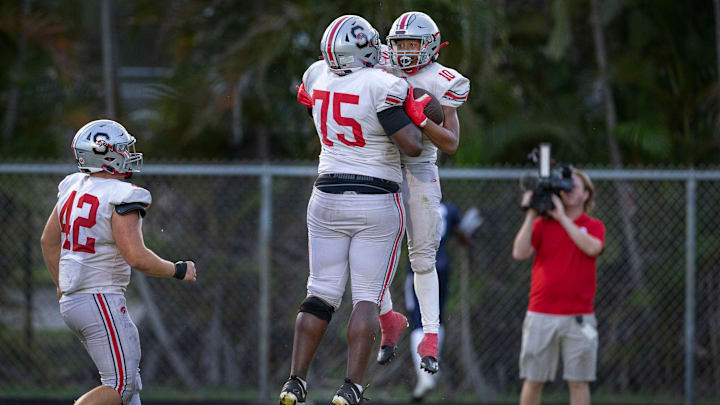 Seminole Ridge running back Willie Young III celebrates his touchdown with Daniel Pierre Louis, (75) against Spanish River on August 30, 2024 in Boca Raton, Florida.