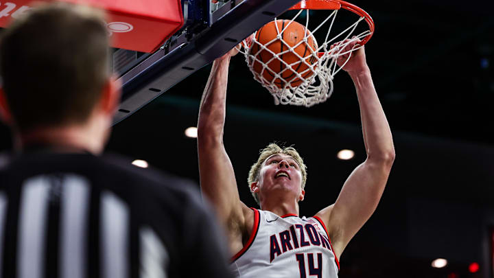 Nov 4, 2024; Tucson, Arizona, USA; Arizona Wildcats center Motiejus Krivas (14) dunks the ball against the Canisius Golden Griffins during the second half at McKale Center. Mandatory Credit: Aryanna Frank-Imagn Images