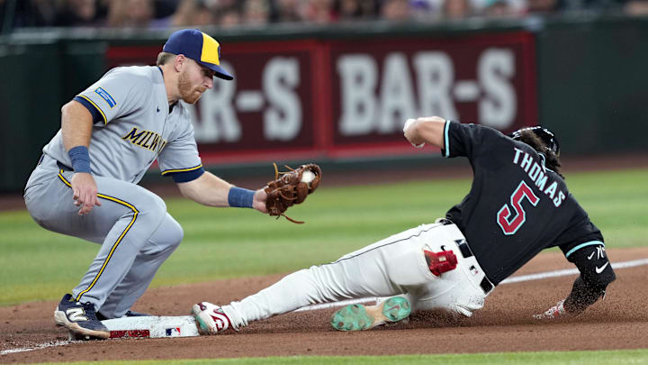 Apr 12, 2025; Phoenix, Arizona, USA; Arizona Diamondbacks outfielder Alek Thomas (5) beats the tag of Milwaukee Brewers third base Oliver Dunn (15) for a triple during the ninth inning at Chase Field. Mandatory Credit: Joe Camporeale-Imagn Images