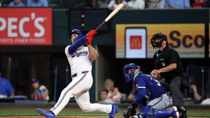 Jun 22, 2024; Arlington, Texas, USA; Texas Rangers left fielder Wyatt Langford (36) hits a grand slam home run in the eighth inning against the Kansas City Royals at Globe Life Field. 