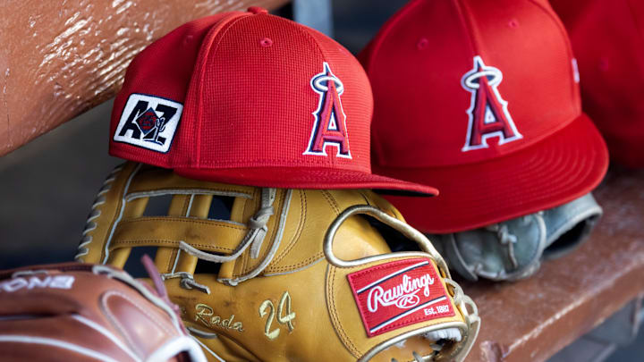 Feb 28, 2025; Phoenix, Arizona, USA; Detailed view of the Los Angeles Angels logo on a hat in the dugout during a spring training game at Camelback Ranch-Glendale. Mandatory Credit: Mark J. Rebilas-Imagn Images Feb 28, 2025; Phoenix, Arizona, USA; Detailed view of the Los Angeles Angels logo on a hat in the dugout during a spring training game at Camelback Ranch-Glendale. Mandatory Credit: Mark J. Rebilas-Imagn Images