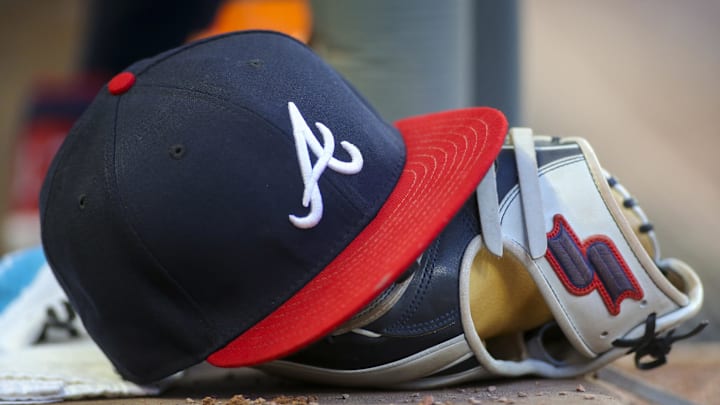 May 31, 2019; Atlanta, GA, USA; Detailed view of hat and glove of Atlanta Braves center fielder Ronald Acuna Jr. (not pictured) against the Detroit Tigers in the fourth inning at SunTrust Park. Mandatory Credit: Brett Davis-Imagn Images
