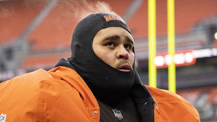 Dec 24, 2022; Cleveland, Ohio, USA; Steam comes off the head of Cleveland Browns offensive tackle Jedrick Wills Jr. (71) as he walks off the field following the game against the New Orleans Saints at FirstEnergy Stadium. Mandatory Credit: Scott Galvin-Imagn Images