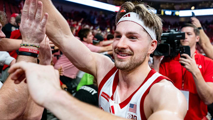 Mar 8, 2026; Lincoln, Nebraska, USA; Nebraska Cornhuskers guard Sam Hoiberg (1) high fives fans after defeating the Iowa Hawkeyes at Pinnacle Bank Arena. Mandatory Credit: Dylan Widger-Imagn Images