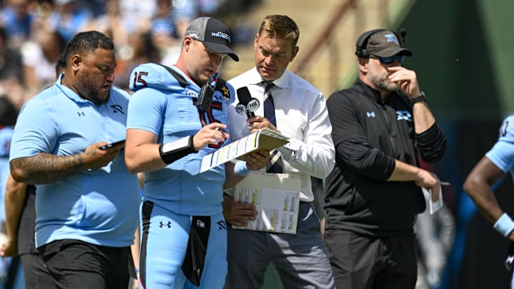 Mar 30, 2024; Arlington, TX, USA; Fox sports sideline reporter and former NFL quarterback Brock Huard talks on the sidelines with Arlington Renegades quarterback Holton Ahlers (15) during the second half of the game against the Birmingham Stallions at Choctaw Stadium. Mandatory Credit: Jerome Miron-Imagn Images