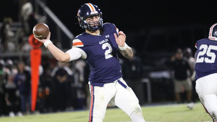Nashville Christian quarterback Jared Curtis (2) drops his arm angle down to make a pass around Fayetteville defenders during the first quarter of their TSSAA football game Friday, Oct. 18, 2024 at Nashville Christian School in Nashville, Tennessee.