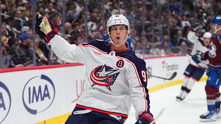 Oct 12, 2024; Denver, Colorado, USA; Columbus Blue Jackets center Kent Johnson (91) celebrates his goal scored in the first period against the Colorado Avalanche at Ball Arena. Mandatory Credit: Ron Chenoy-Imagn Images