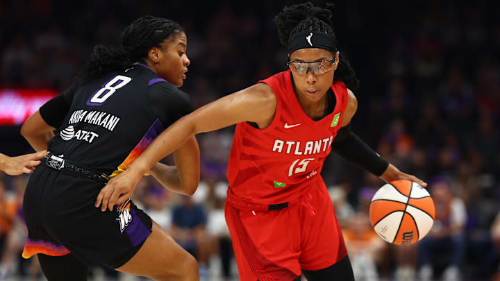 Aug 10, 2025; Phoenix, Arizona, USA; Atlanta Dream guard Allisha Gray (15) moves the ball against Phoenix Mercury guard Monique Akoa Makani (8) in the first half at Footprint Center. Mandatory Credit: Mark J. Rebilas-Imagn Images