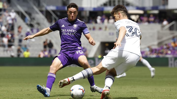 Apr 9, 2022; Orlando, Florida, USA; Chicago Fire midfielder Gaston Gimenez (30) controls the ball in