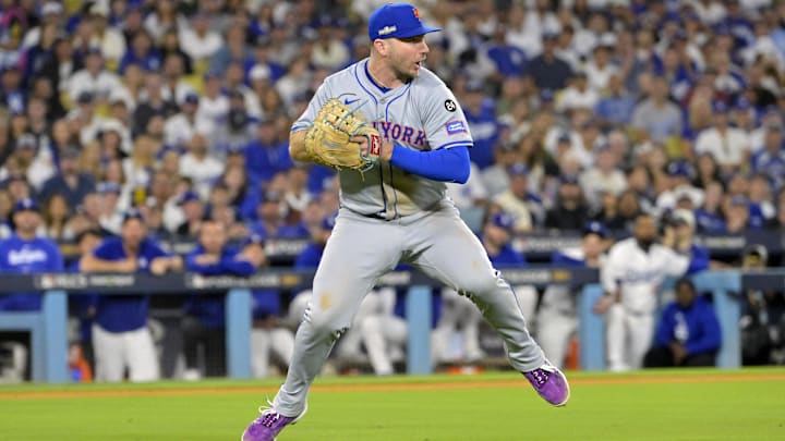 Oct 20, 2024; Los Angeles, California, USA; New York Mets first baseman Pete Alonso (20) fields the ball hit by Los Angeles Dodgers second baseman Chris Taylor (not pictured) in the sixth inning during game six of the NLCS for the 2024 MLB playoffs at Dodger Stadium. Mandatory Credit: Jayne Kamin-Oncea-Imagn Images