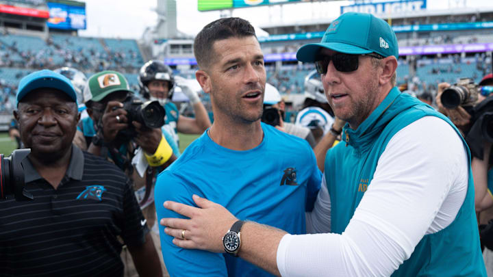 Carolina Panthers head coach Dave Canales and Carolina Panthers head coach Liam Coen met at the center of the field after the game between the Carolina Panthers at Jacksonville Jaguars at EverBank Stadium Sunday September 7, 2025. Jaguars defeated the Panthers 26-10. [Doug Engle/Florida Times-Union]