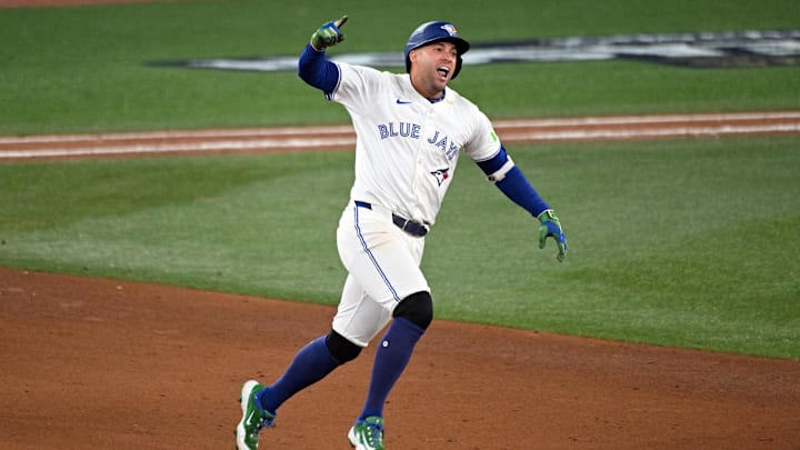 Toronto Blue Jays right fielder George Springer (4) celebrates as he runs the bases after hitting a three run home run against the Seattle Mariners in the seventh inning during game seven of the ALCS round for the 2025 MLB playoffs at Rogers Centre. Toronto Blue Jays right fielder George Springer (4) celebrates as he runs the bases after hitting a three run home run against the Seattle Mariners in the seventh inning during game seven of the ALCS round for the 2025 MLB playoffs at Rogers Centre.