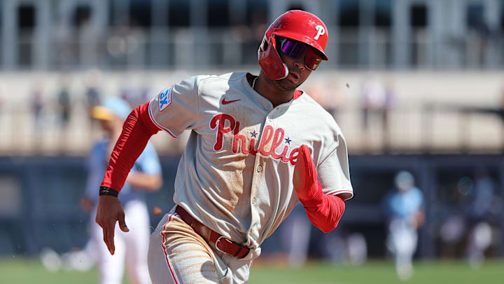 Feb 25, 2025; Port Charlotte, Florida, USA;  Philadelphia Phillies outfielder Justin Crawford (80) runs home to score against the Tampa Bay Rays during the fourth inning at Charlotte Sports Park. Mandatory Credit: Kim Klement Neitzel-Imagn Images