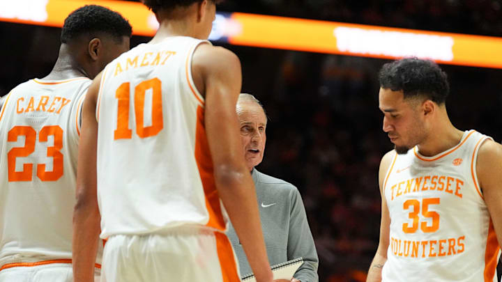 Tennessee basketball coach Rick Barnes huddles with Tennessee forwards Jaylen Carey (23) and Nate Ament (10), and guard Ethan Burg (35) during an NCAA college basketball . Tennessee basketball coach Rick Barnes huddles with Tennessee forwards Jaylen Carey (23) and Nate Ament (10), and guard Ethan Burg (35) during an NCAA college basketball .