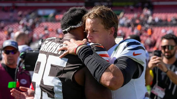 Cleveland Browns defensive end Myles Garrett (95) and Cincinnati Bengals quarterback Joe Burrow (9) hug after the fourth quarter of the NFL Week 1 game between the Cleveland Browns and the Cincinnati Bengals at Huntington Bank Field in Cleveland on Sunday, Sept. 7, 2025. The Bengals begin the season with a 17-16 win over the Browns.