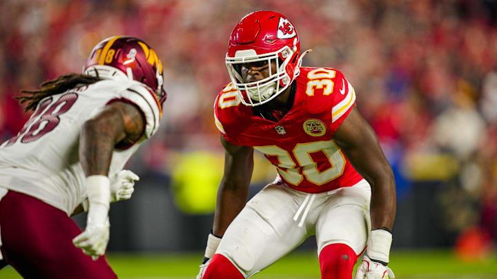 Oct 27, 2025; Kansas City, Missouri, USA; Kansas City Chiefs cornerback Chris Roland-Wallace (30) defends Washington Commanders safety Tyler Owens (18) during the second half at GEHA Field at Arrowhead Stadium. Mandatory Credit: Jay Biggerstaff-Imagn Images