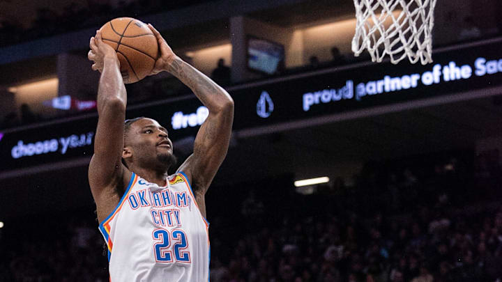 Nov 25, 2024; Sacramento, California, USA; Oklahoma City Thunder guard Cason Wallace (22) dunks the ball against the Sacramento Kings during the third quarter at Golden 1 Center. Mandatory Credit: Ed Szczepanski-Imagn Images