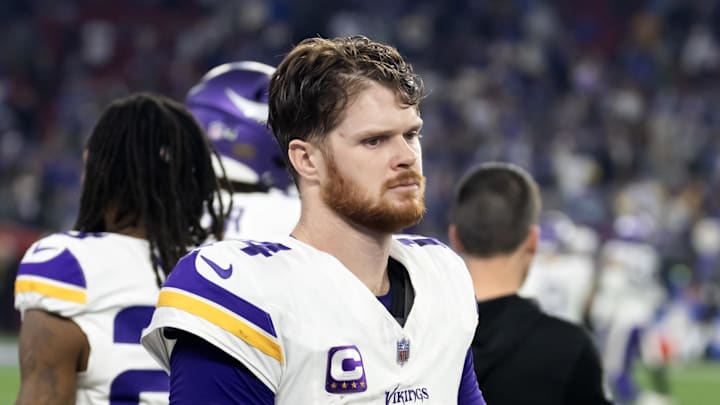 Jan 13, 2025; Glendale, AZ, USA; Minnesota Vikings quarterback Sam Darnold (14) reacts in the closing seconds of the game against the Los Angeles Rams during an NFC wild card game at State Farm Stadium. Mandatory Credit: Mark J. Rebilas-Imagn Images
