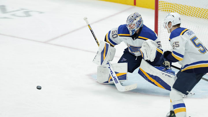 Feb 2, 2025; Salt Lake City, Utah, USA; St. Louis Blues goaltender Jordan Binnington (50) catches the puck during the third period against the Utah Hockey Club at Delta Center. Mandatory Credit: Chris Nicoll-Imagn Images