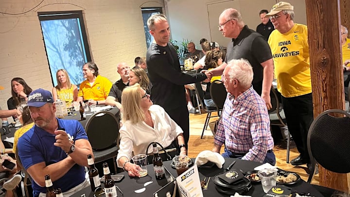 Ben McCollum greets fans at the Nile Kinnick I-Club in Omaha on May 14. The new Iowa men's basketball coach happily circled the room before and after the event.