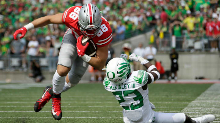 Ohio State Buckeyes tight end Jeremy Ruckert (88) is tripped up by Oregon Ducks safety Verone McKinley III (23) during Saturday's NCAA Division I football game at Ohio Stadium in Columbus on September 11, 2021.

Osu21ore Bjp 34