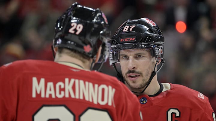 Feb 15, 2025; Montreal, Quebec, CAN; [Imagn Images direct customers only] Team Canada forward Nathan MacKinnon (29) and teammate forward Sidney Crosby (87) prepare for a face-off against Team United States in the second period during a 4 Nations Face-Off ice hockey game at the Bell Centre. Mandatory Credit: Eric Bolte-Imagn Images