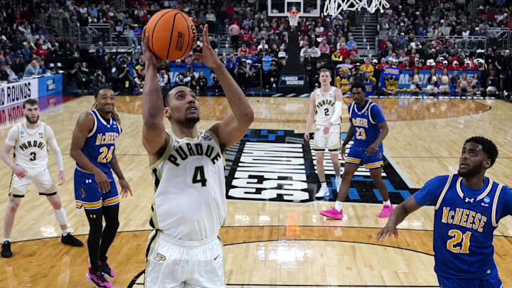 Mar 22, 2025; Providence, RI, USA; Purdue Boilermakers forward Trey Kaufman-Renn (4) shoots a layup against McNeese State Cowboys guard Sincere Parker (21) during the second half at Amica Mutual Pavilion. Mar 22, 2025; Providence, RI, USA; Purdue Boilermakers forward Trey Kaufman-Renn (4) shoots a layup against McNeese State Cowboys guard Sincere Parker (21) during the second half at Amica Mutual Pavilion.
