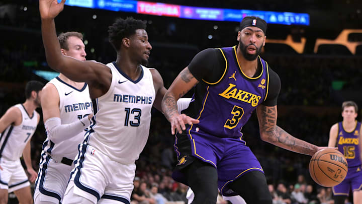 Jan 5, 2024; Los Angeles, California, USA; Memphis Grizzlies forward Jaren Jackson Jr. (13) defends Los Angeles Lakers forward Anthony Davis (3) in the first half at Crypto.com Arena. Mandatory Credit: Jayne Kamin-Oncea-Imagn Images