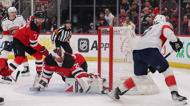 New Jersey Devils goaltender Jacob Markstrom (25) makes a save on Florida Panthers center Sam Bennett (9) during the first period at Prudential Center. Mandatory Credit: Ed Mulholland-Imagn Images New Jersey Devils goaltender Jacob Markstrom (25) makes a save on Florida Panthers center Sam Bennett (9) during the first period at Prudential Center. Mandatory Credit: Ed Mulholland-Imagn Images
