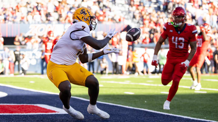Nov 30, 2024; Tucson, Arizona, USA; Arizona State Sun Devils tight end Chamon Metayer (7) catches a touchdown pass against the Arizona Wildcats in the first half during the Territorial Cup at Arizona Stadium. Mandatory Credit: Mark J. Rebilas-Imagn Images