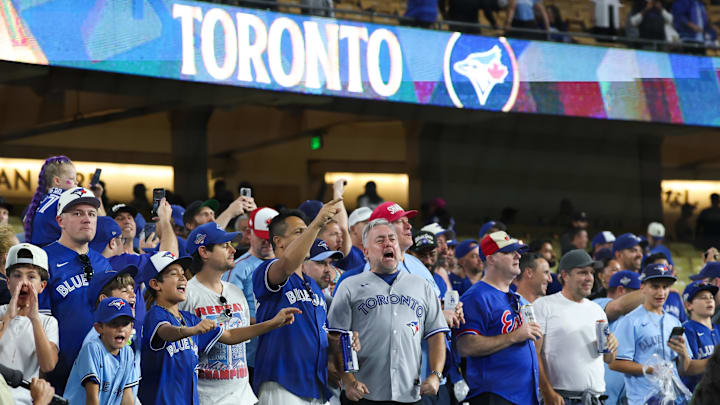 Toronto Blue Jays fans cheer after the game against the Los Angeles Dodgers.