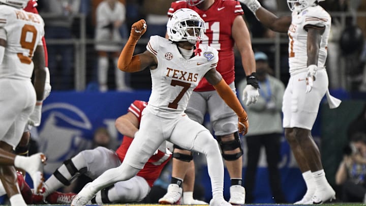 Jan 10, 2025; Arlington, Texas, USA; Texas Longhorns defensive back Jahdae Barron (7) celebrates after a sack during the second quarter of the College Football Playoff semifinal against the Ohio State Buckeyes in the Cotton Bowl at AT&T Stadium. Mandatory Credit: Jerome Miron-Imagn Images
