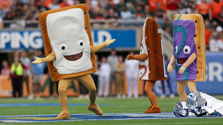 Dec 28, 2024; Orlando, FL, USA; Pop Tart mascots entertain the fans before Pop Tarts bowl between the Iowa State Cyclones and Miami Hurricanes at Camping World Stadium. Mandatory Credit: Nathan Ray Seebeck-Imagn Images