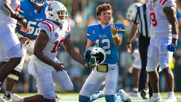 Tulane quarterback Kai Horton shows his displeasure over having his helmet pulled off. Tulane quarterback Kai Horton shows his displeasure over having his helmet pulled off.