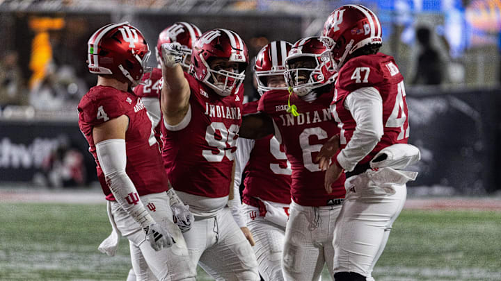 Nov 30, 2024; Bloomington, Indiana, USA; Indiana Hoosiers defensive lineman James Carpenter (99) celebrates his run for a first down with teammates  in the second half against the Purdue Boilermakers at Memorial Stadium. Mandatory Credit: Trevor Ruszkowski-Imagn Images