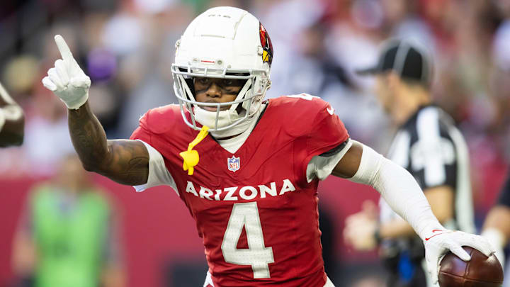Jan 5, 2025; Glendale, Arizona, USA; Arizona Cardinals wide receiver Greg Dortch (4) celebrates after scoring a touchdown against the San Francisco 49ers in the first half at State Farm Stadium. Mandatory Credit: Mark J. Rebilas-Imagn Images