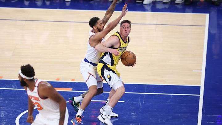 May 21, 2025; New York, New York, USA; Indiana Pacers guard T.J. McConnell (9) controls the ball against New York Knicks guard Cameron Payne (1) in the second quarter during game one of the eastern conference finals for the 2025 NBA Playoffs at Madison Square Garden. Mandatory Credit: Wendell Cruz-Imagn Images