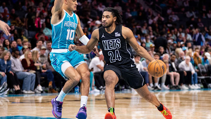 Mar 8, 2025; Charlotte, North Carolina, USA; Brooklyn Nets guard Cam Thomas (24) drives on Charlotte Hornets guard Josh Green (10) during the second quarter at Spectrum Center. Mandatory Credit: Scott Kinser-Imagn Images Mar 8, 2025; Charlotte, North Carolina, USA; Brooklyn Nets guard Cam Thomas (24) drives on Charlotte Hornets guard Josh Green (10) during the second quarter at Spectrum Center. Mandatory Credit: Scott Kinser-Imagn Images