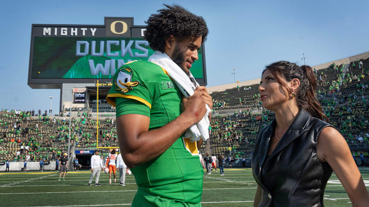 Oregon quarterback Dante Moore is interviewed on the field after the win over Oklahoma State at Autzen.
