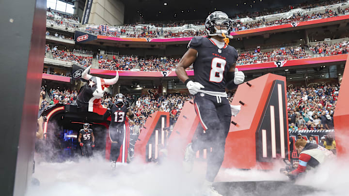 Dec 15, 2024; Houston Texans wide receiver John Metchie III (8) runs onto the field before the game against the Miami Dolphins at NRG Stadium. Mandatory Credit: Troy Taormina-Imagn Images
