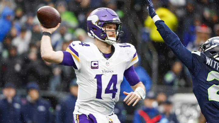 Dec 22, 2024; Seattle, Washington, USA; Minnesota Vikings quarterback Sam Darnold (14) passes against the Seattle Seahawks during the second quarter at Lumen Field.