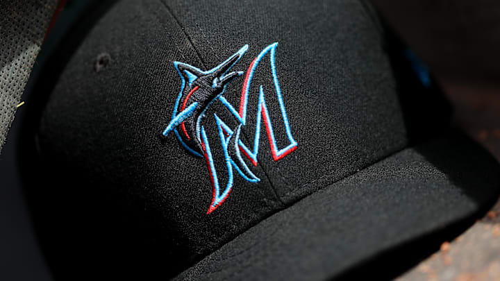 Apr 11, 2019; Cincinnati, OH, USA; A view of a New Era Miami Marlins hat in the dugout during the game against the Cincinnati Reds at Great American Ball Park. Mandatory Credit: Aaron Doster-Imagn Images Apr 11, 2019; Cincinnati, OH, USA; A view of a New Era Miami Marlins hat in the dugout during the game against the Cincinnati Reds at Great American Ball Park. Mandatory Credit: Aaron Doster-Imagn Images