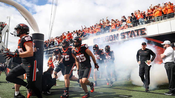 Oregon State Beavers run onto the field before the annual rivalry game against the Oregon Ducks on Saturday, Sept. 14, 2024 at Reser Stadium in Corvallis, Ore.